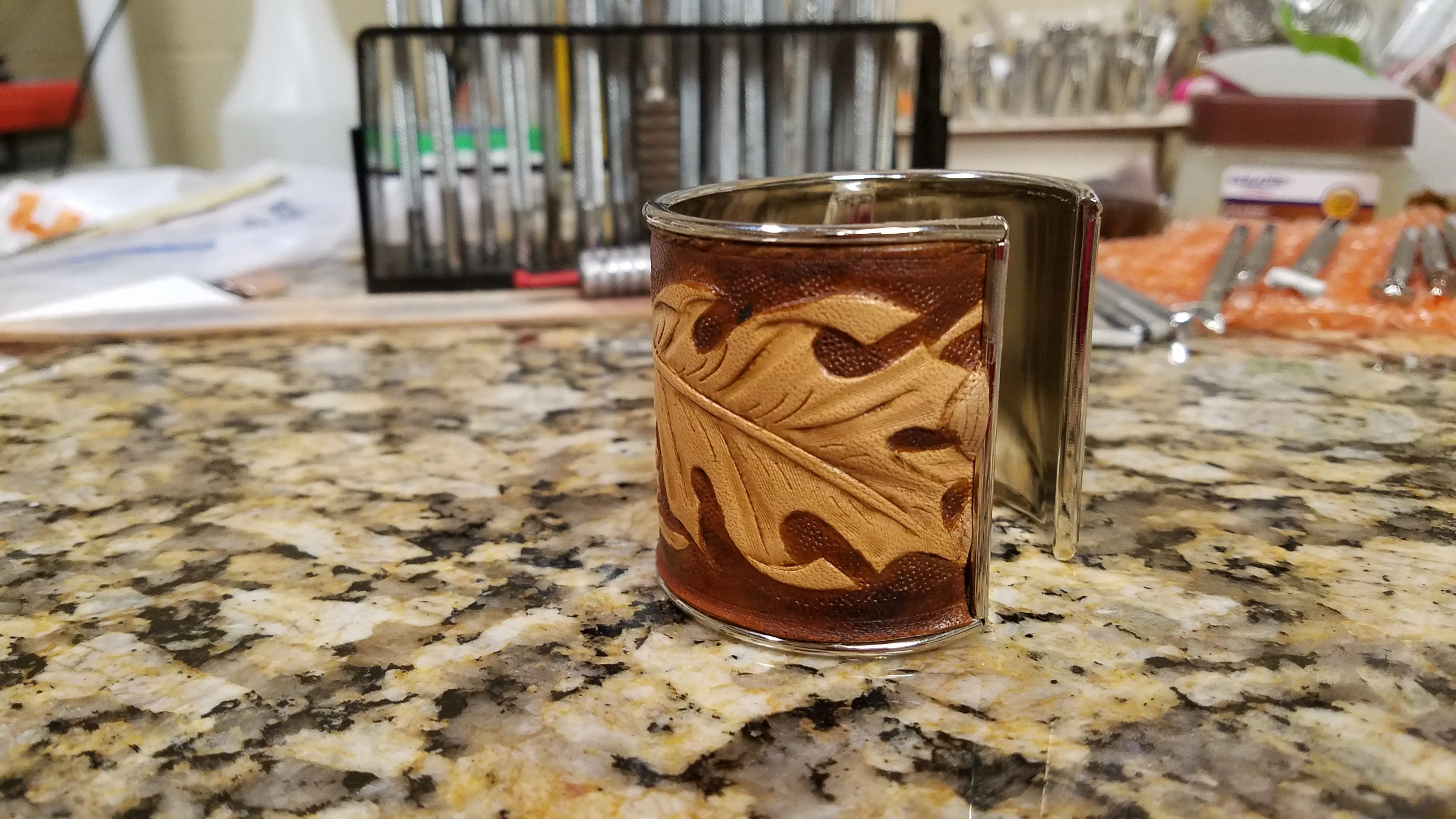 Leather cuff with acorns
